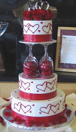 Round Wedding Cake with Red Hearts Red Roses and Wine Glass Pillars