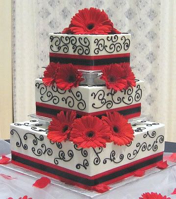 White and black wedding cakes with red flowers